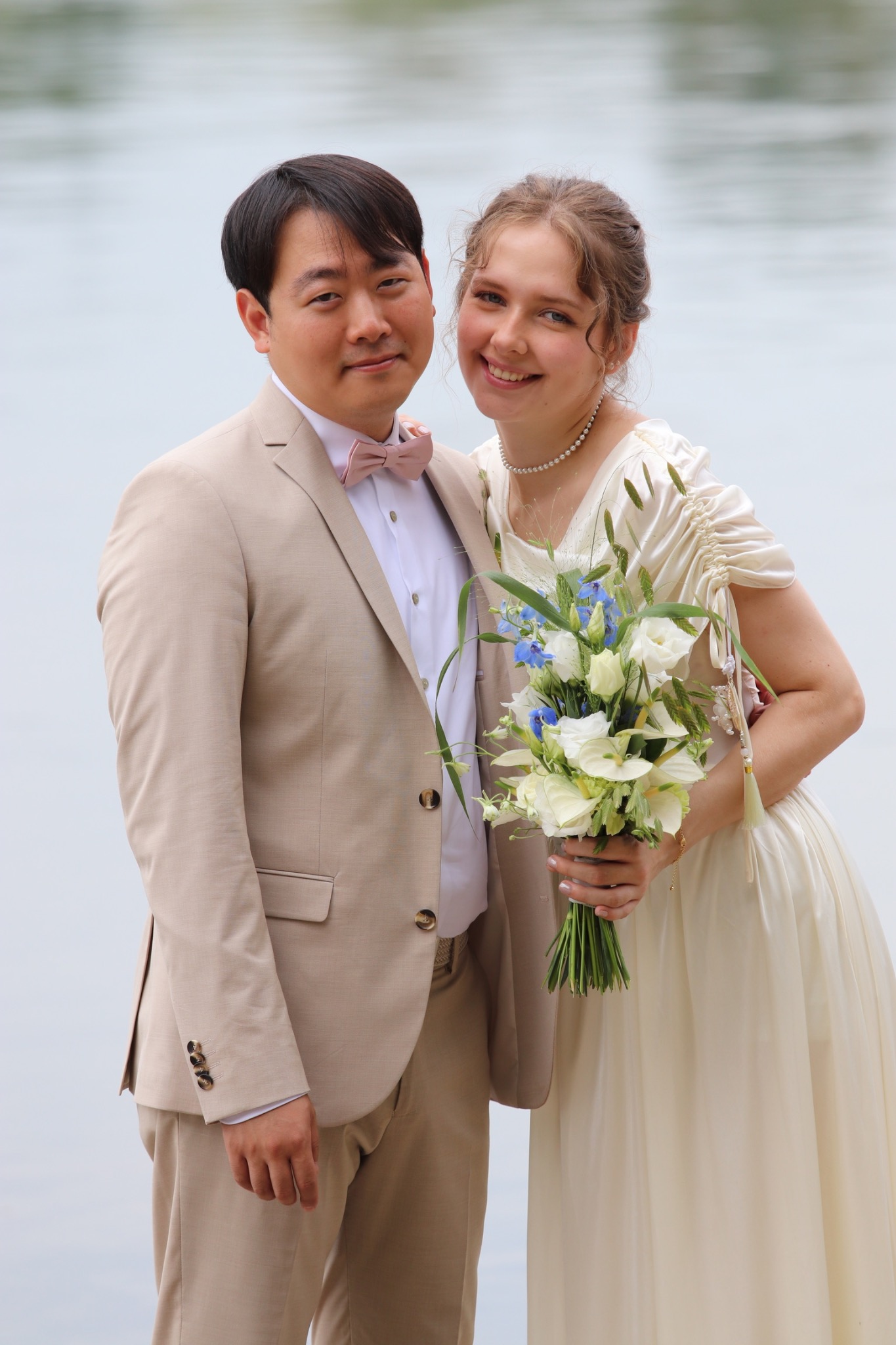 Yongjai and Vanessa smiling together on their wedding day